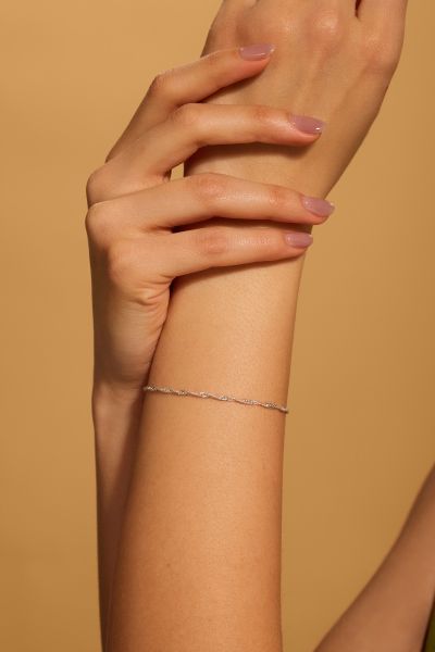 Sterling Silver 2mm diamond cut Singapore link bracelet with lobster clasp - Click to magnify